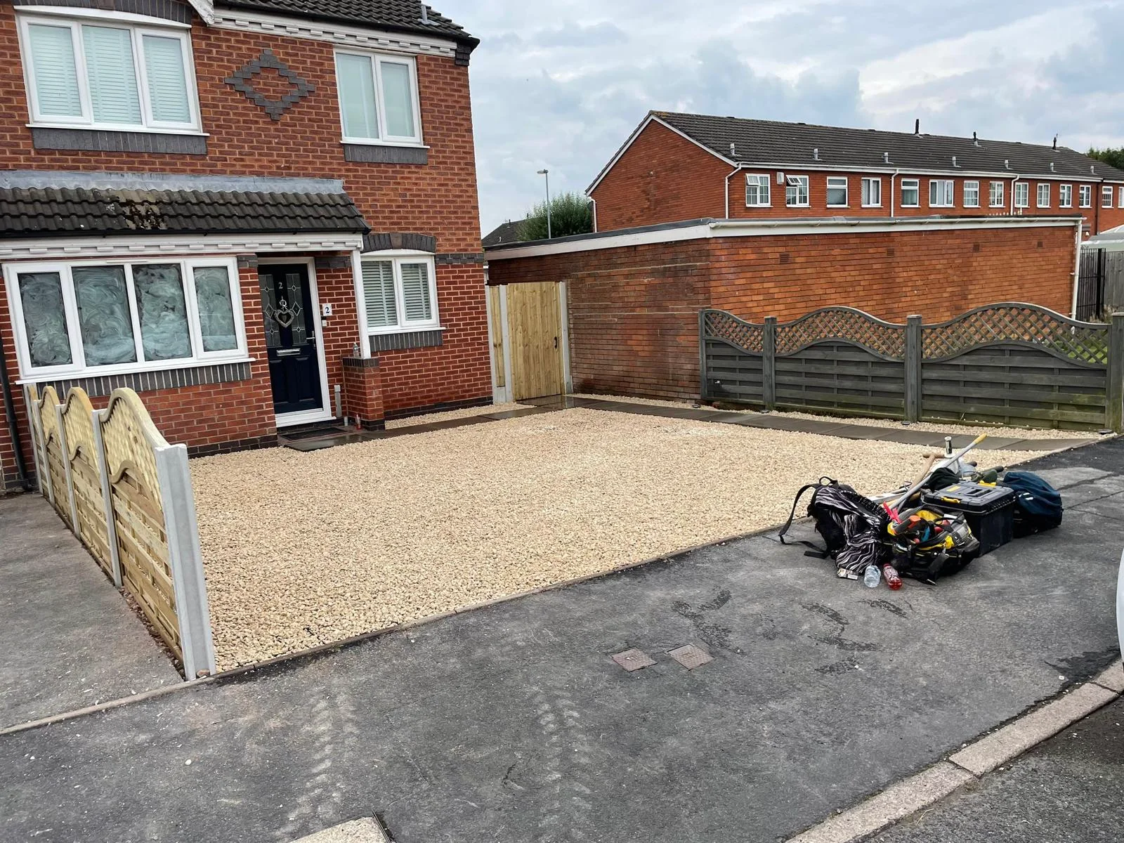New gravel driveway with driveway gates and fencing in Staffordshire.