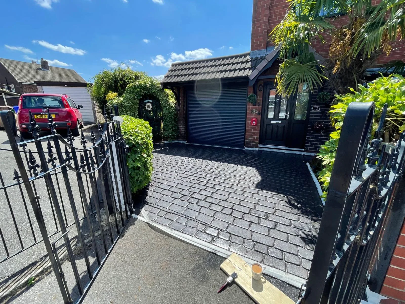 Grey concrete imprint driveway after cleaning, sealing and colour work in Staffordshire.